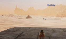 Character overlooking a vast desert landscape in game.